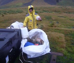 Man with marine debris and soccer ball