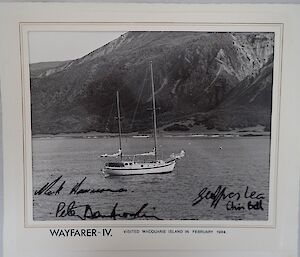 Yacht on water with island in background