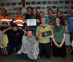 A group of people holding a sign saying ‘we stand with the world’s park rangers'