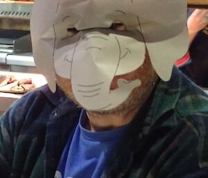 A man in an elephant face mask