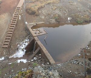 A dam next to a boardwalk