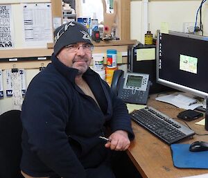 A man sits in an office