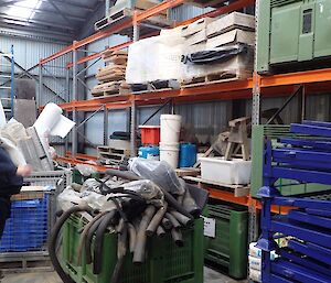 A man surveys a wall of racking