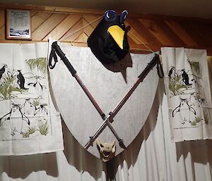 A coat of arms created out of tea towels and penguin head