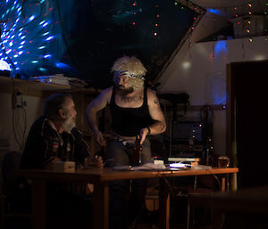 2 men talking at a table