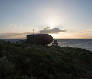 The approach to the hut at sunset from the south.