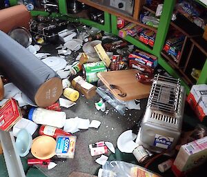 The floor of the hut covered with broken things post earthquake.