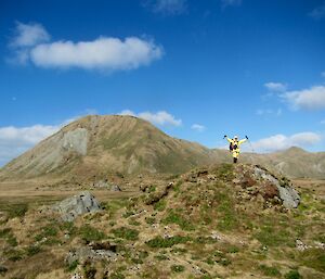 A man salutes the sky on the ‘featherbed'