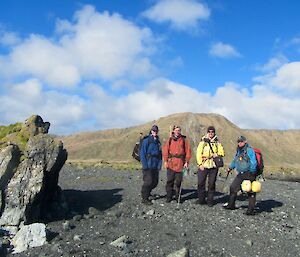 Group photo of four people ready to set out on northern giant petrel census