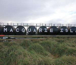 Freshly painted lettering on the fuel farm tanks