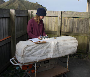 A woman using the Dobson to do a zenith cloud reading