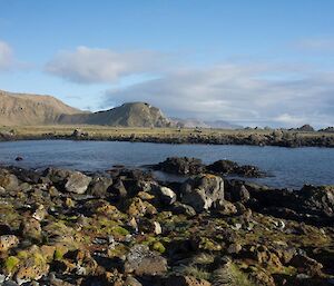 A picture of coastline with hills over the water, looking at Unity Bay from Eagle Point