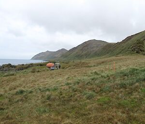 A picture of Waterfall Bay hut in-situ on the east coast