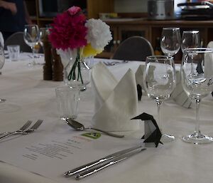 A table formally set for a dinner with nice glasses and napkins