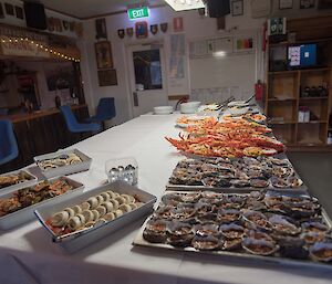 Platters of seafood sitting on a table
