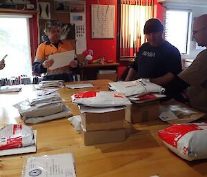 People around a table of mail