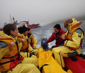 First load of expeditioners coming to shore in an inflatable rubber boar