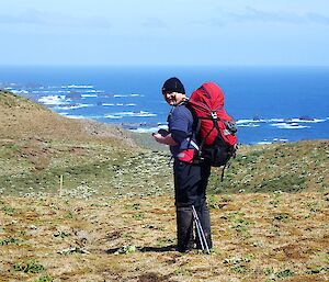 A man with the west coast and sea in background