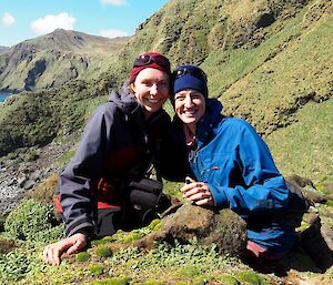 Penny and Kim crouching on the ground at West Rock