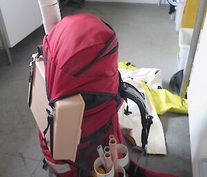 A photo of a backpack loading with sampling equipment