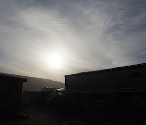 Sundogs, or Parhelia, are a halo phenomena, occurring 22 degrees from the sun. They are the bright coloured spots either side of the sun near the edges of the photo, and are caused by light interacting with the ice in the Cirrostratus cloud. Cirrus fibratus and Cirrocumulus cloud is also present in the picture.