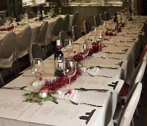 A long table set for Christmas dinner,