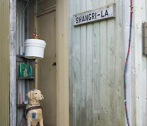 Fibreglass dog in the outdoor shower