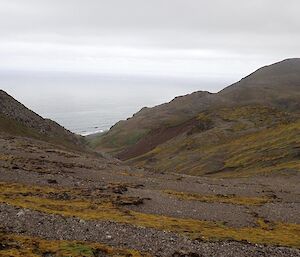 The ‘terracing’ (layers of gravel & vegetation) caused by freezing and thawing that is common on the plateau — foreground of shot