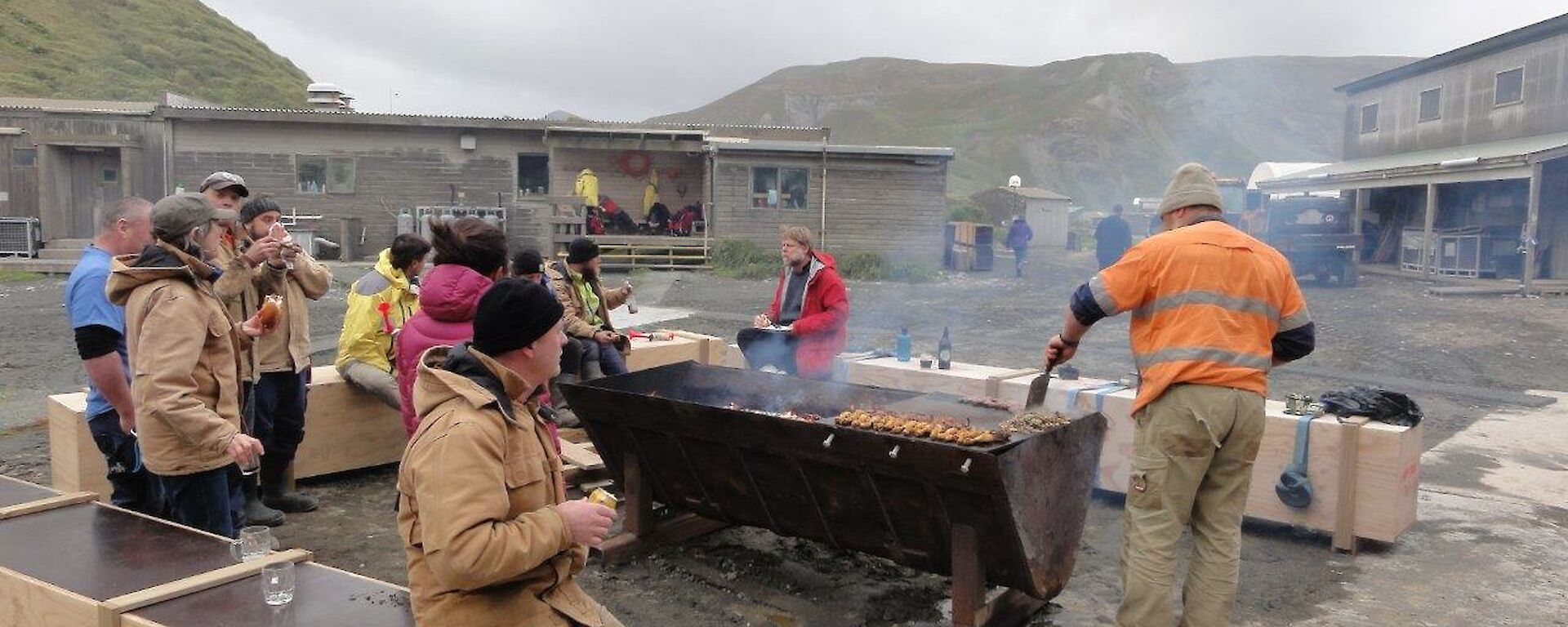 A group of people having a BBQ