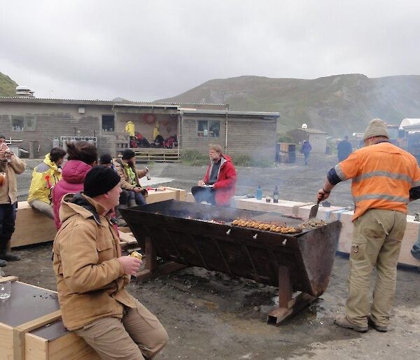 A group of people having a BBQ