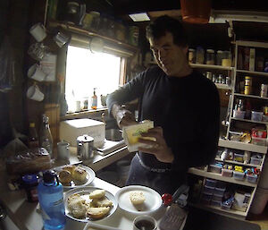 A man in the kitchen making scones