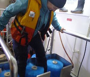 A woman goes through the automatic boot washed on board