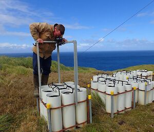 A man taking the monthly monitoring images at the seed orchard