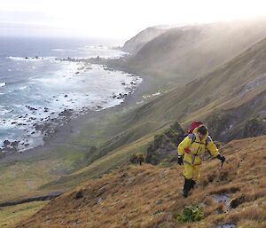 A man climbs the hill out of Sandell Bay