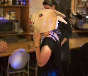 A woman in a rabbit mask