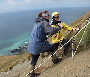 2 people monitoring Azorella on the eastern escarpment.