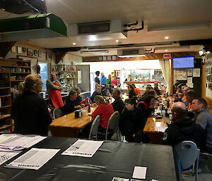 A group of expeditioners in the station getting briefed on resupply