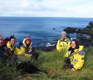 A photo of the Australian Antarctic Director Nick Gales with Tasmania Parks & Wildlife Staff on North Head Macquarie Island