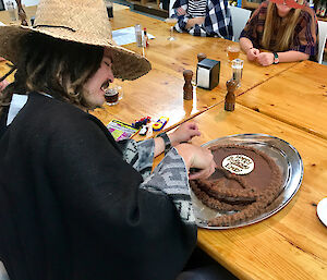 Macca Bureau of Meterology Technical Officer and Observer Emry Thaggard-Crocker enjoying his look-a-like birthday cake