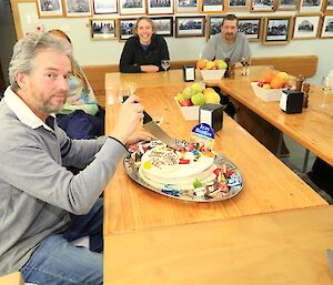 Matt Westbury cutting into his Fray Bentos themed birthday cake — Macquarie Island