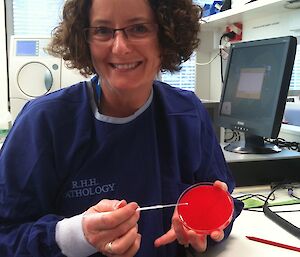 Doctor Jan Wallace undertaking microbiology training before departure