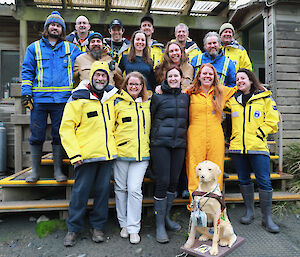 A photo of all the expeditioners at the front of a building.