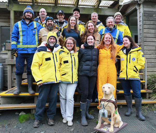 A photo of all the expeditioners at the front of a building.