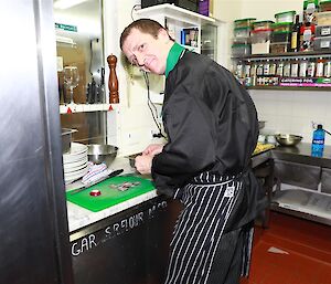 The Maquarie Island chef in the kitchen preparing food.