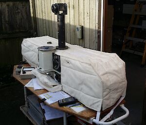 A machine called the Dobson Spectrophotometer sitting on a desk.