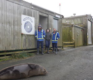 The three Bureau of Meteorology team stand outside a building.