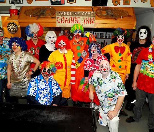 A group of people at a clown-themed birthday party.