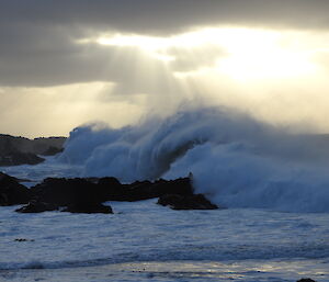 Green Gorge beachfront in stormy weather — waves crashing over rocks.