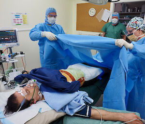 Prepping the patient for mock appendicitis surgery.