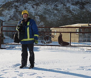 A man standing out in the snow.